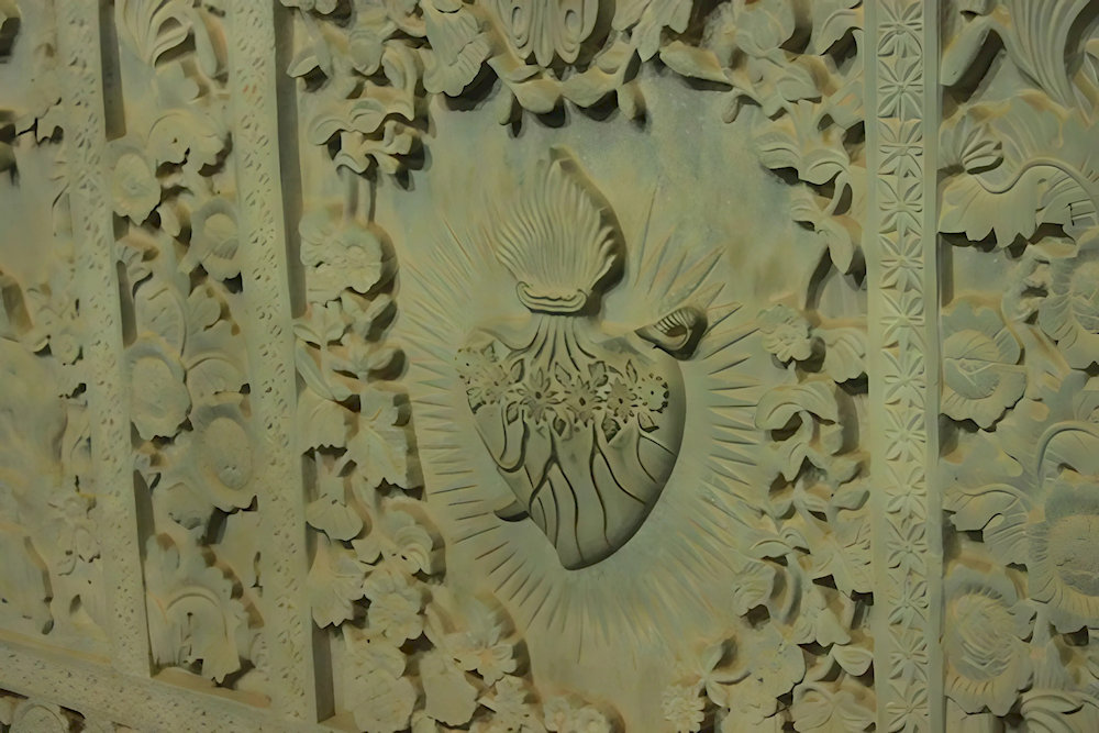 The heart pierced by a sword symbolizes Mary's sorrow, especially during the crucifixion of Jesus